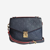 Monogram Empreinte Pochette metis