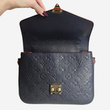 Monogram Empreinte Pochette metis
