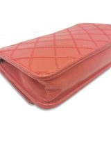 Rød quilted lambskin WOC taske fra brand: CHANEL - We Do Vintage