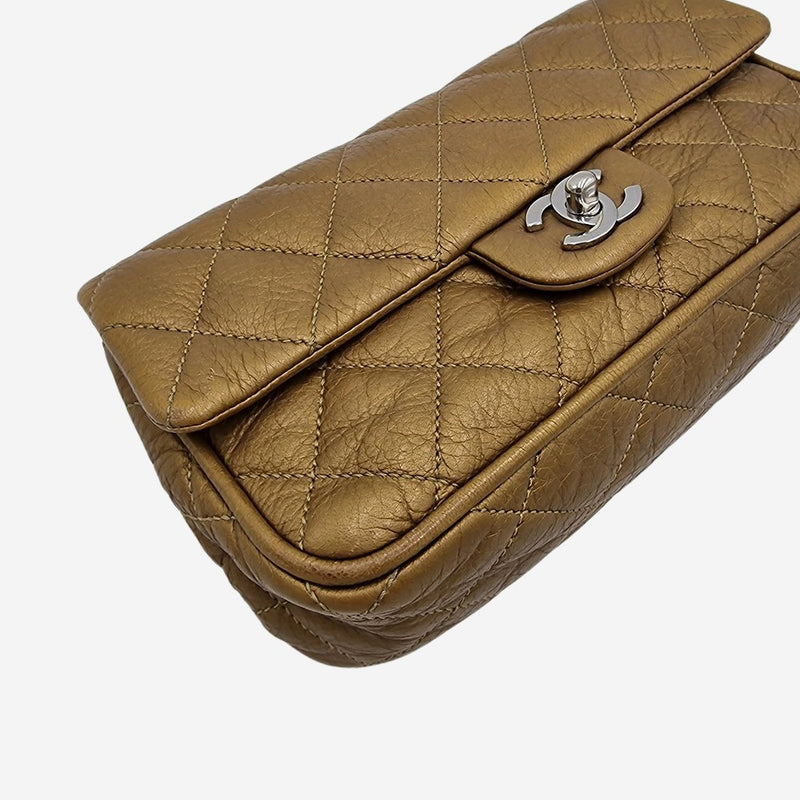 Dark gold east west flap bag