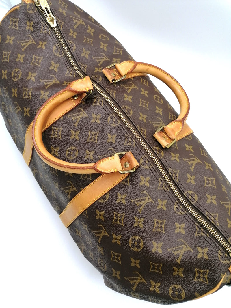 Sold at Auction: LOUIS VUITTON (Printemps-été 2016) SAC Keepall en toile  Monogram Palm Dots et cuir naturel, garnitures en laiton doré, anse b